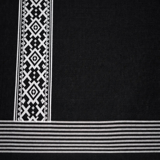 Black printed dhoti with traditional design, handwoven by Ramachandra Kuthampully Handlooms.