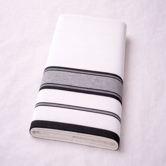 White double mundu with elegant classic kara, traditional Kerala handloom by Ramachandra Kuthampully Handlooms.