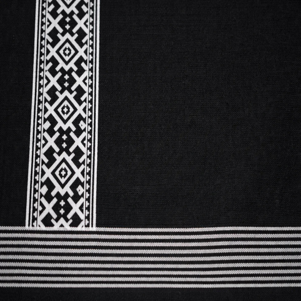 Black printed dhoti with traditional design, handwoven by Ramachandra Kuthampully Handlooms.