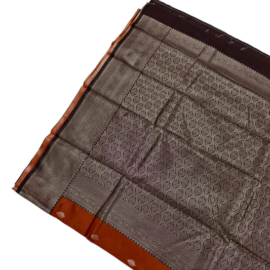 Burned orange saree with coffee brown border by Ramachandra Kuthampully Handlooms.